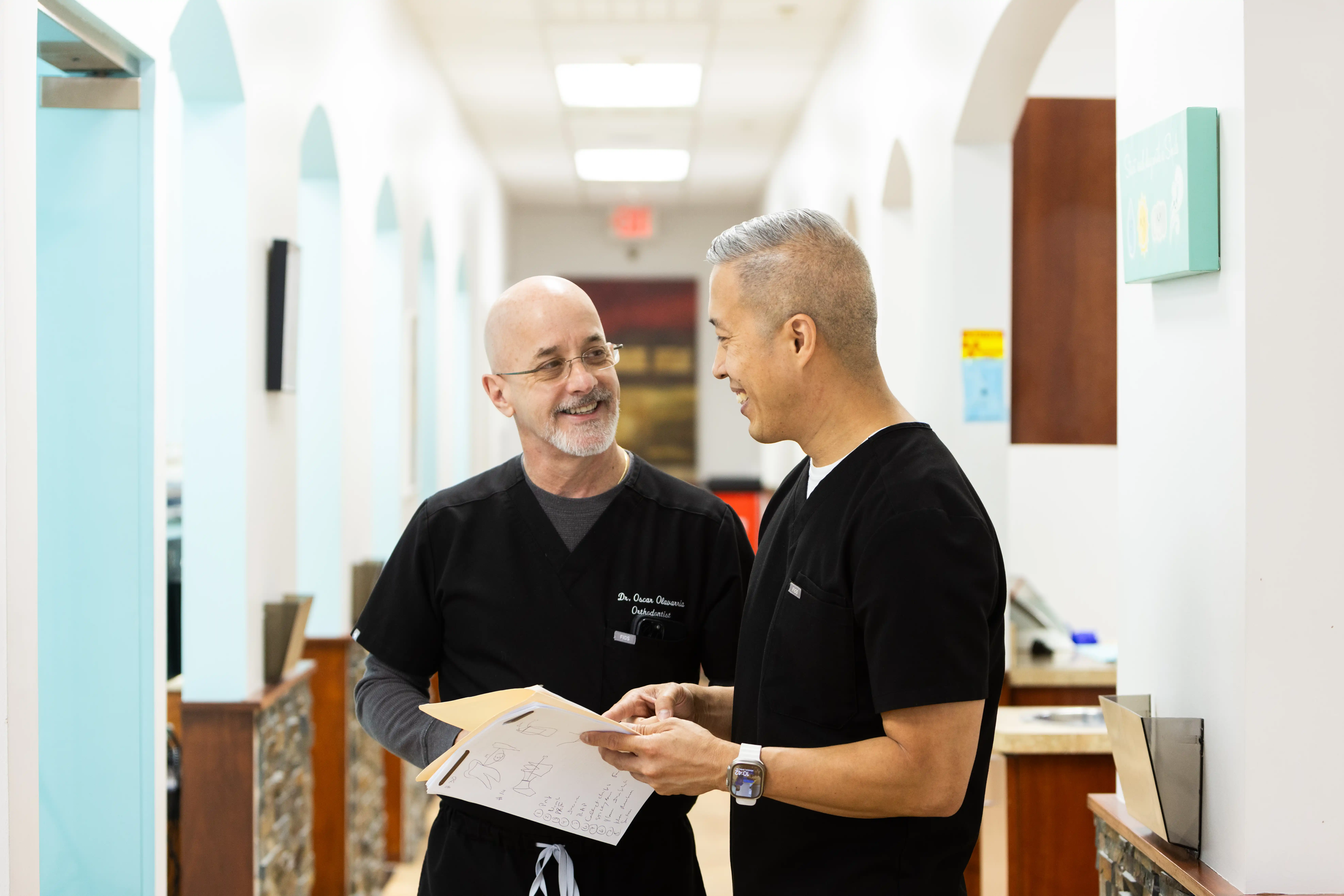 Dental team discussing TMJ Treatment in Sugar Land
