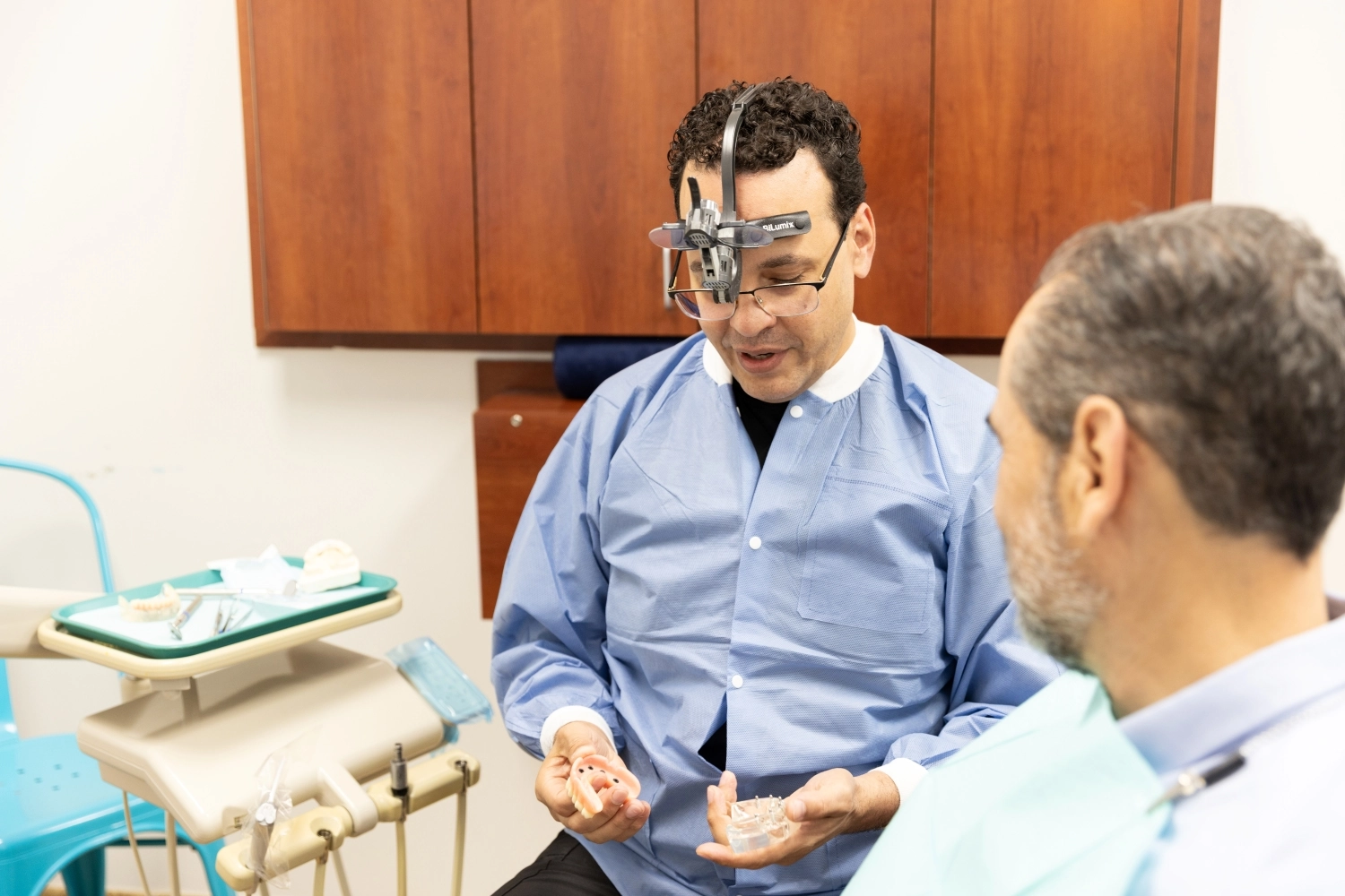 Dental technician using CAD/CAM technology