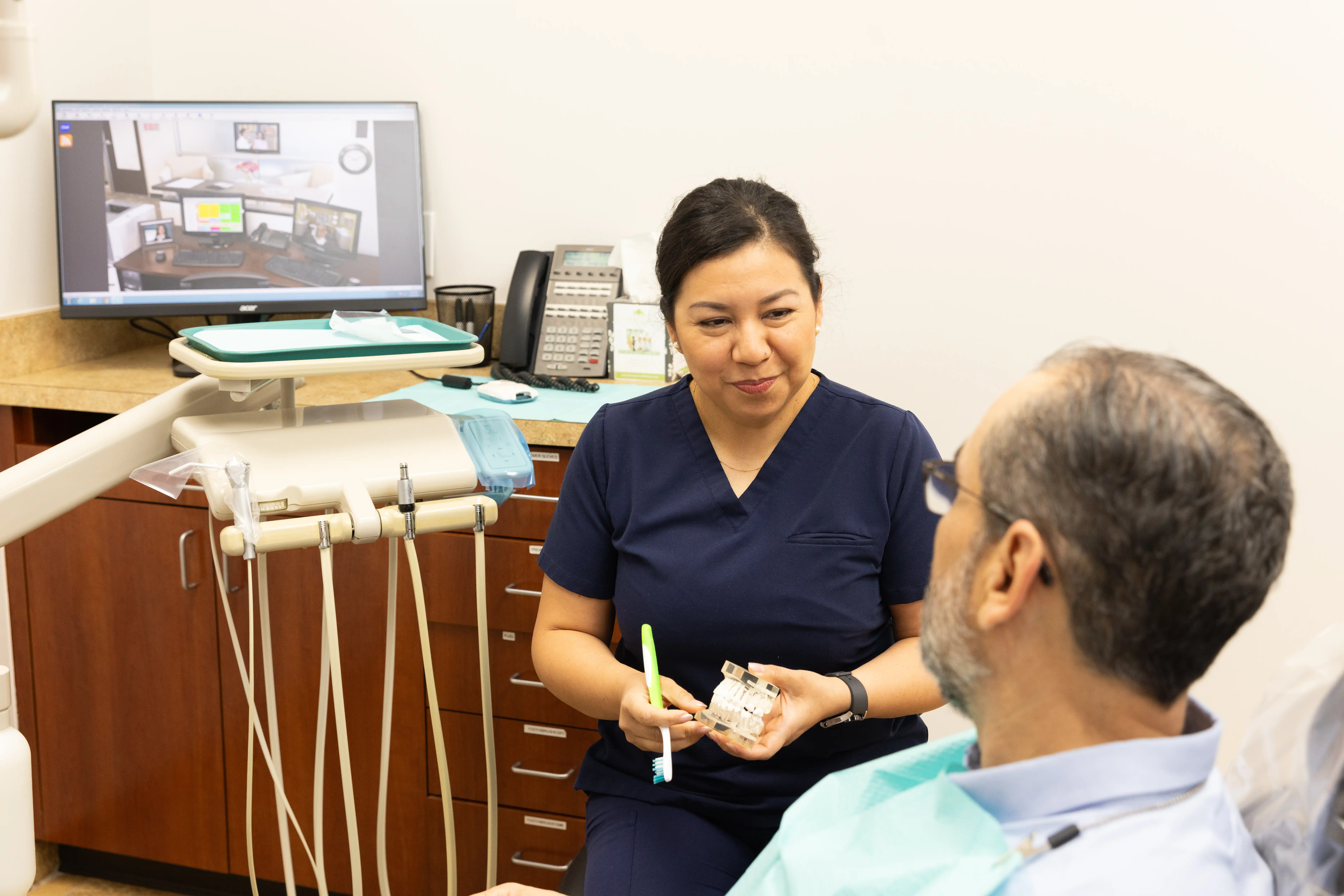 Hygienist preparing a patient for their dental veneers